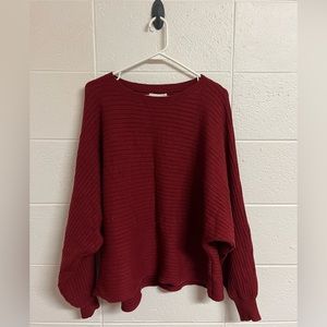 Gently used red sweater.